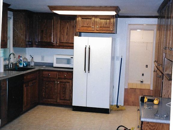 kitchen view and hallway from dining room. room at the end of the hallway is laundry