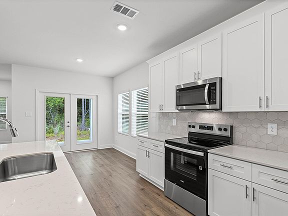 Kitchen in the Northbrook floorplan at a Meritage Homes community in Ocean Springs, MS.