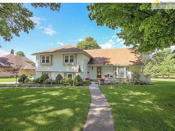 Home has newer double driveway and spacious level lot