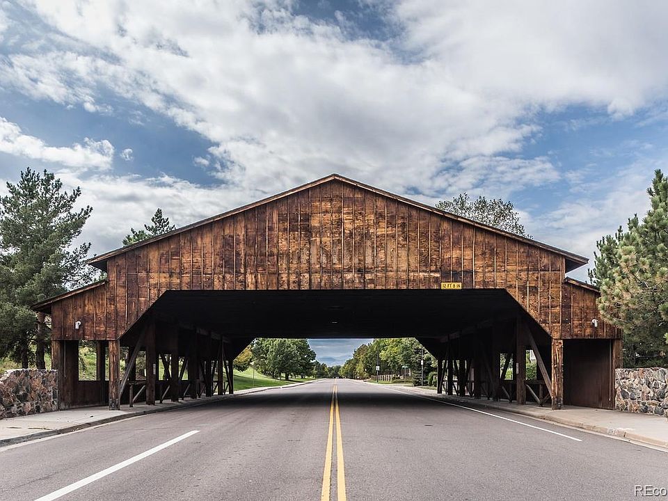 Covered wooden bridge entrance to community