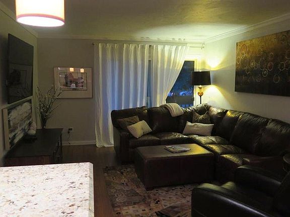 Large living room w/patio door to extra large balcony