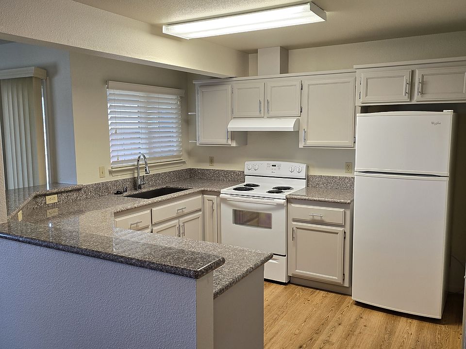 Kitchen adjacent to living room at left
