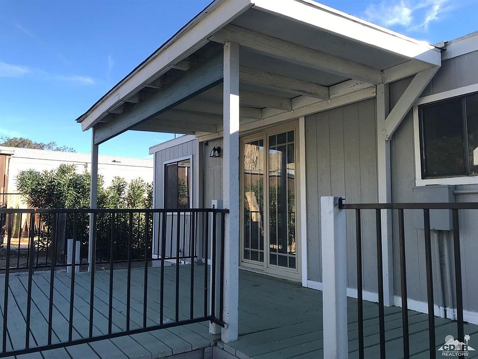 Sliding glass door opens to the rear covered porch.