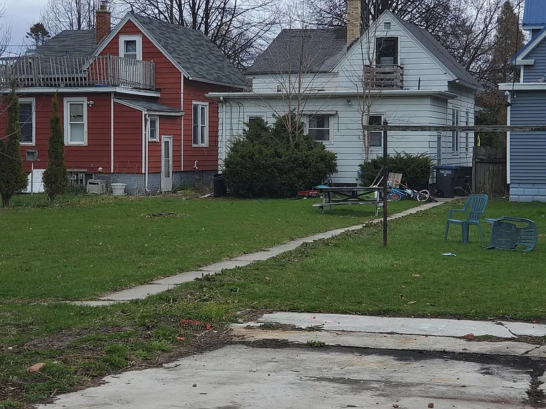 Large backyard, bushes are being removed