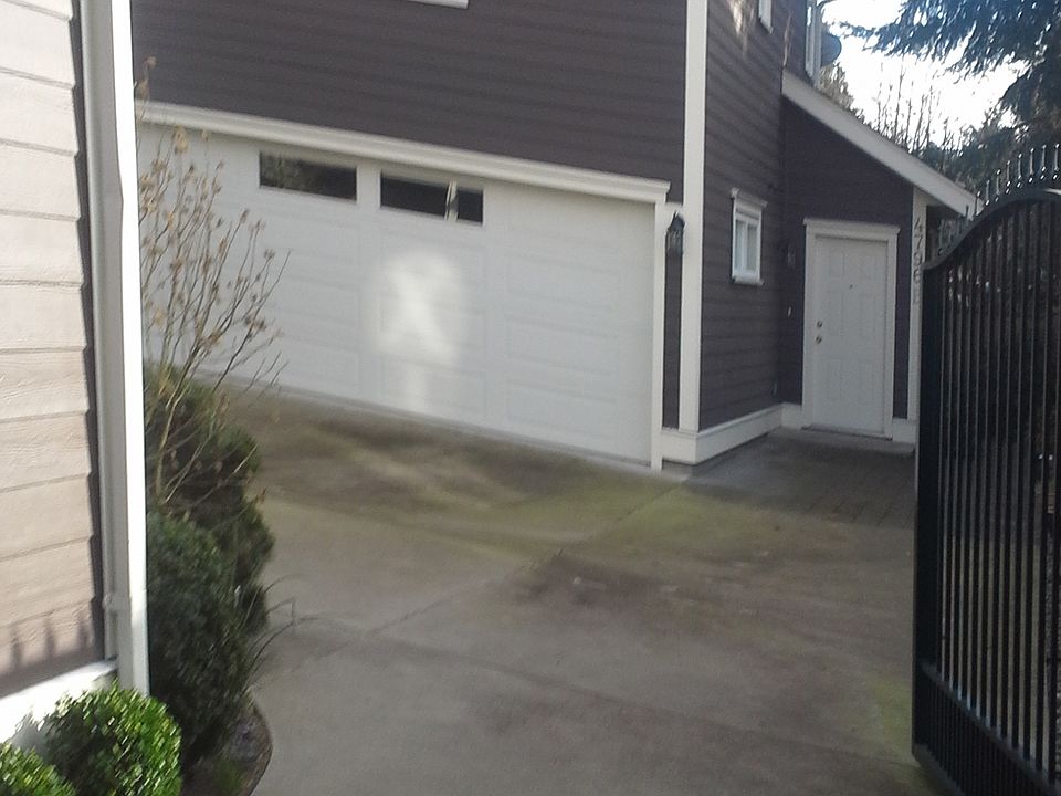 Front door, parking stall. 2 car garage not used. Storage space for owner so no disruptive noise.