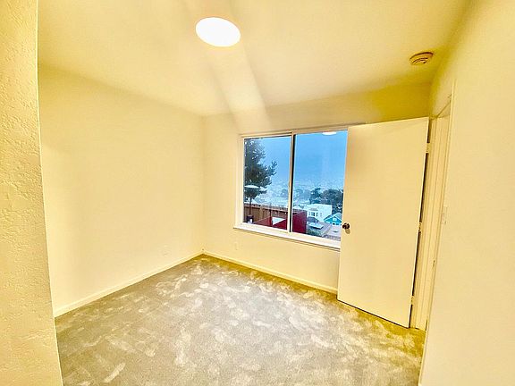 Small bedroom with view and closet