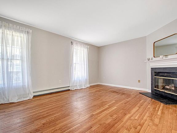 Living Room Features Fireplace and Great Bright Space for Entertaining.