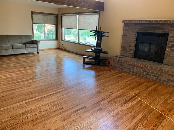 Living room with fireplace, hardwoods