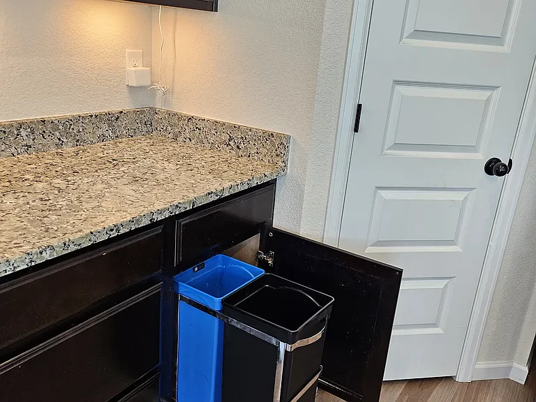 Kitchen garbage/recycle drawer.