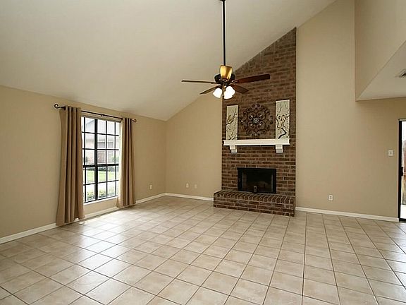 Two story living room with windows that face the expansive f