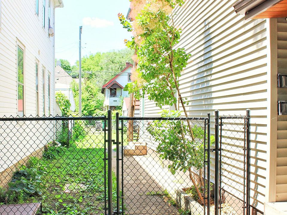 Fenced in side-yard with 5-foot black vinyl fence. Great for dogs.