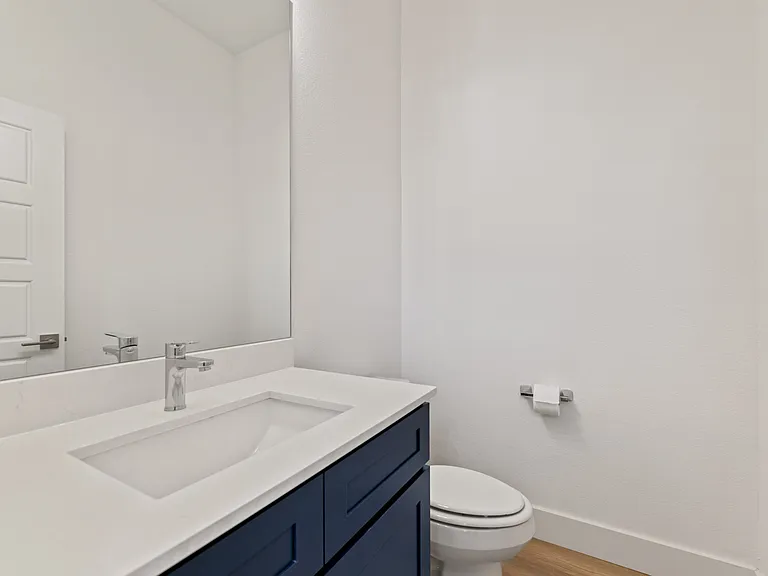 The half bath downstairs is perfect for guests and family.