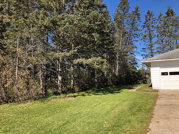 West side of house and driveway to the garage