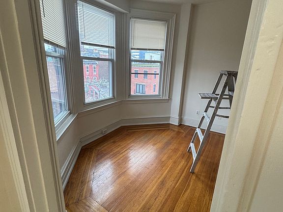 Living room ceiling fan with light. Hardwood floor