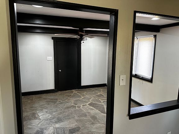 Dining Room with rustic floor