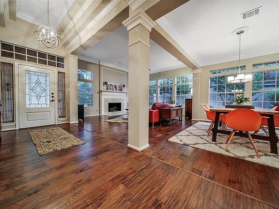 High ceilings, open space between formal dining and living. Great entertaining space! IDEA for flex space: add set of barn doors to have option of closing off formal living room from dining room!