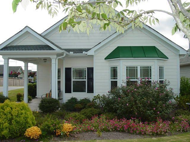 Charming cottage home in very desireable neighborhood. Beautifully landscaped.