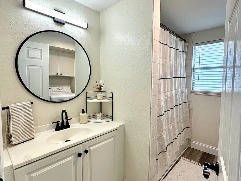 Bathroom, with laundry in unit