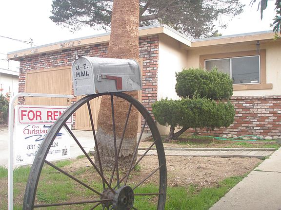 Mailbox sitting on an iron wheel