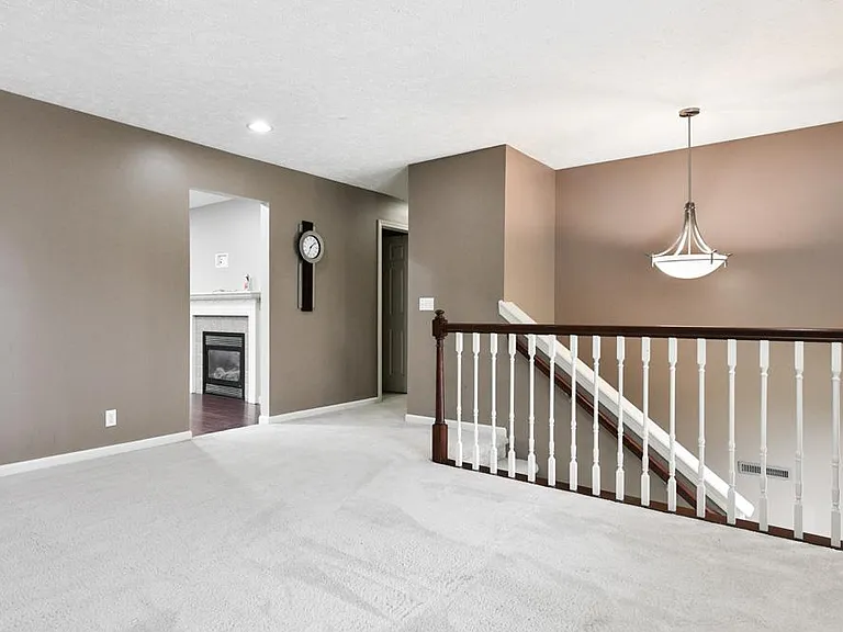 Entry Stairs to Living, Family Rooms and Hallway to Bedrooms