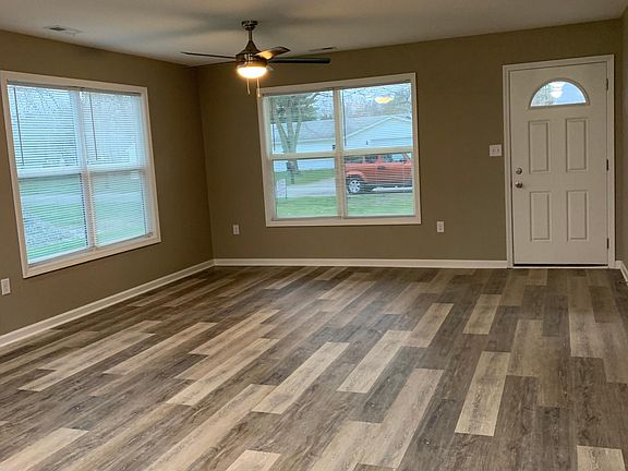 Vinyl flooring- living room includes a ceiling fan