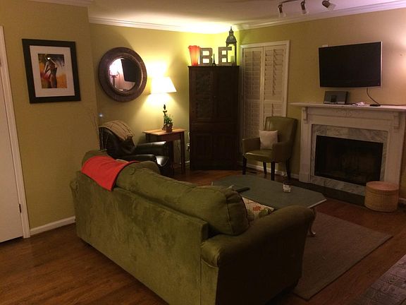 Newly tiled fireplace in den - has been painted neutral whit