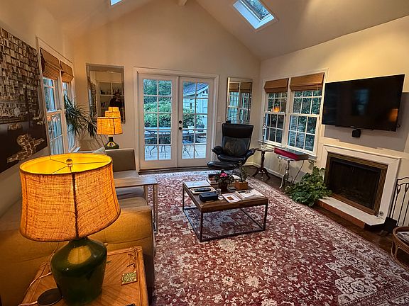 Sunroom that opens up through the French doors into the backyard