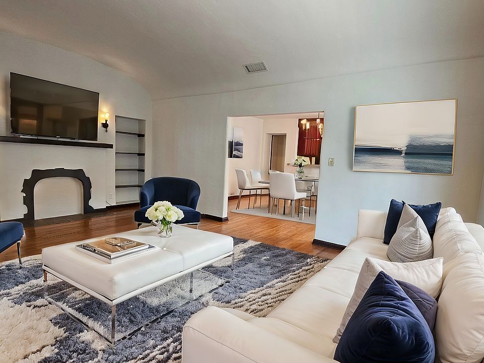 Livingroom with built-in shelves & decorative fireplace