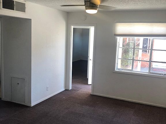 Large tv room next to kitchen