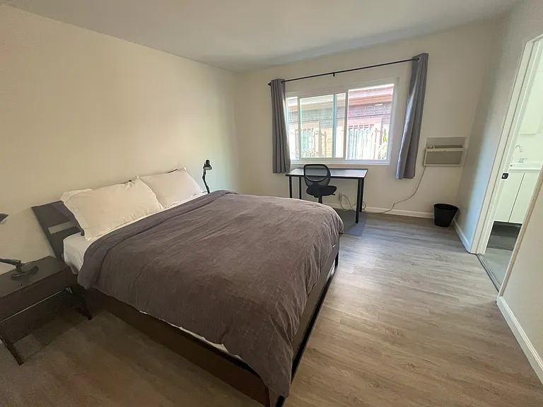 Primary Bedroom (queen bed, ensuite bathroom, walk in closet)