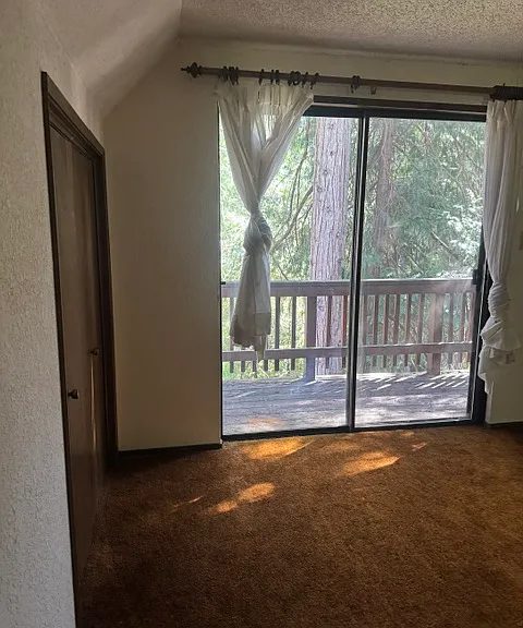 UPSTAIRS BEDROOM WITH BALCONY ON EACH SIDE