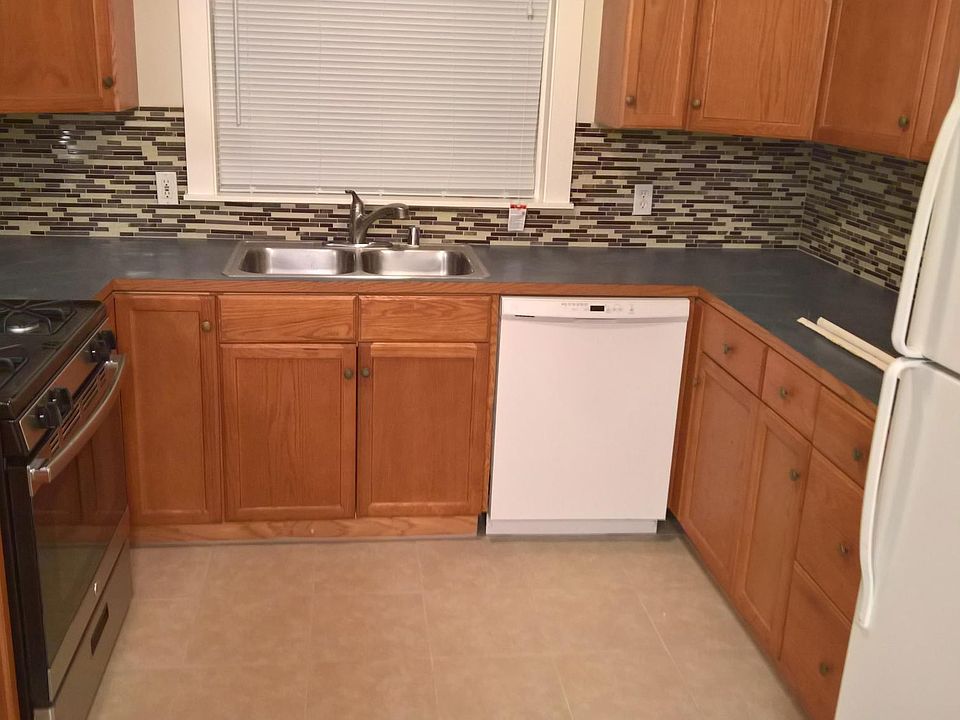Recently updated kitchen - appliances, splash, tile floor.