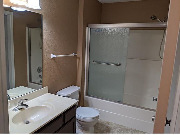 Nice bathroom with sliding shower doors.