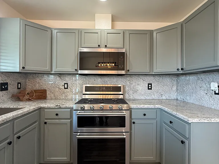 New stainless steel Kitchen-Aid double oven with stove, New Kitchen-Aid hooded microwave