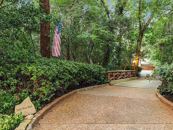 Located at the end of a cul-de-sac, a private entry driveway leads to the secluded residence. The thick vegetation, dense mature azaleas, and native Texas plantings welcome you as you enter the driveway. The private bridge was completely reconstructe