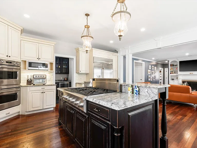 Open floor plan, large kitchen and family room with fireplace