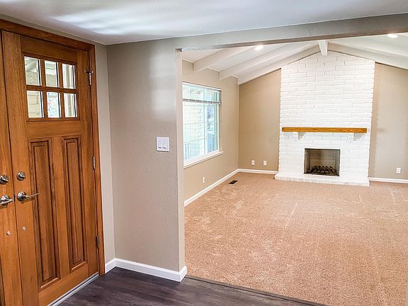 Living room with gas fireplace and dimmable lights