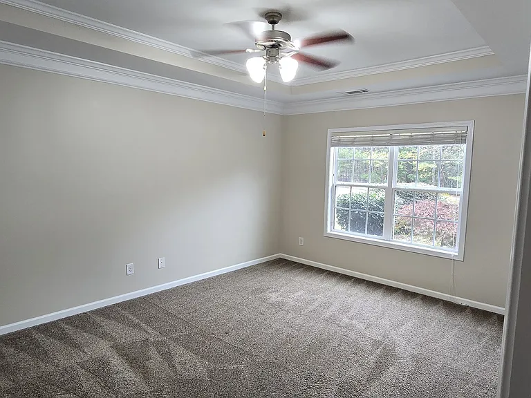 Master bedroom with vaulted ceiling