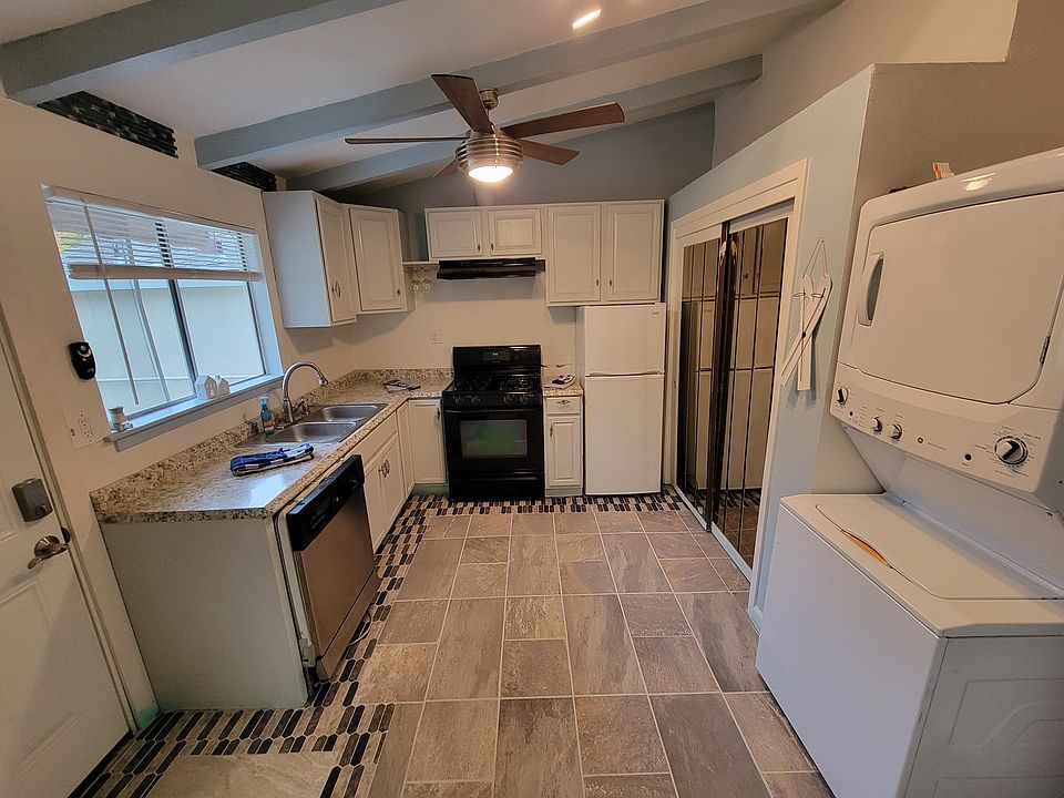 From Left front door and kitchen end with full size laundry stackable.