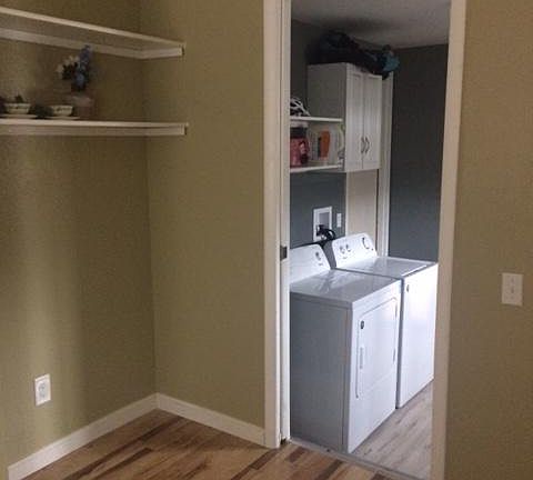 New washer and dryer in new laundry room with new floors