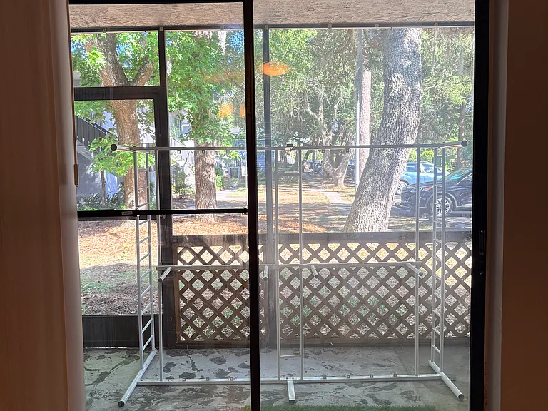 Screen porch with entry from den, and screen door to outside