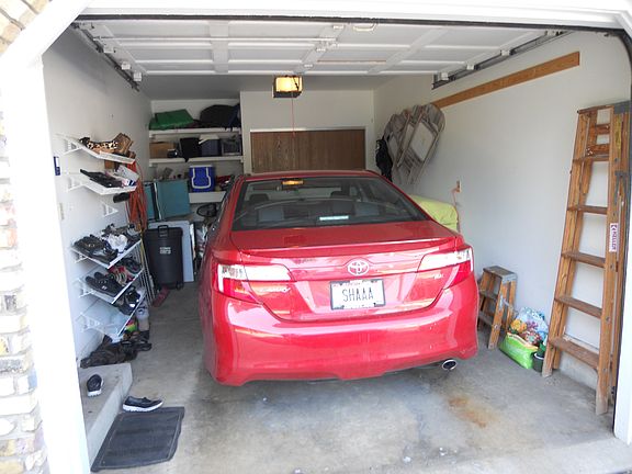 I car attached garage w/ extra storage and shelving