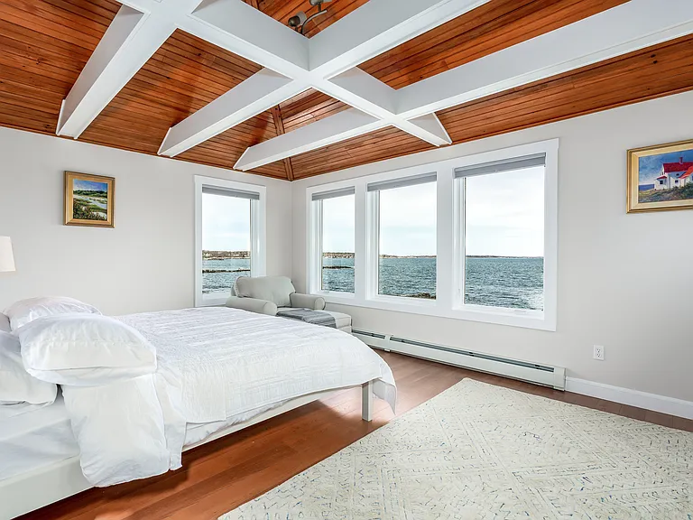 The third floor master bedroom with a king bed. Panoramic ocean views.
