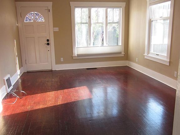 Living room with big windows and plenty of light.