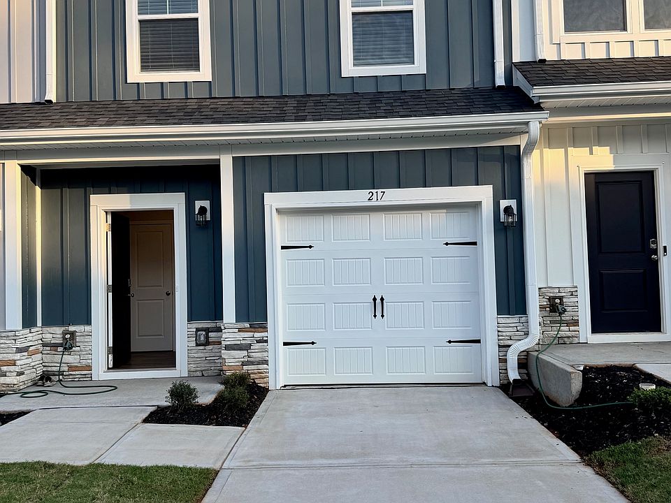 Porch Covered Entrance and single care driveway