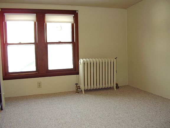 Upstairs bedroom with new carpet, paint and access to extensive attic space, possible expansion!