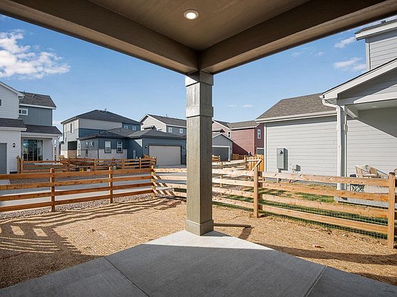 View from covered patio to side yard
