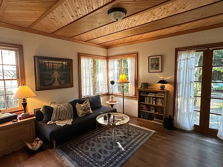 Second Bedroom can be a library, or an office, has pull out bed, quaint wood ceilings, luggage rack