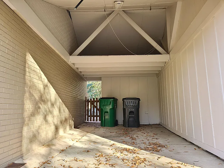 The car port offers plenty of outdoor storage for equipment and toys.
