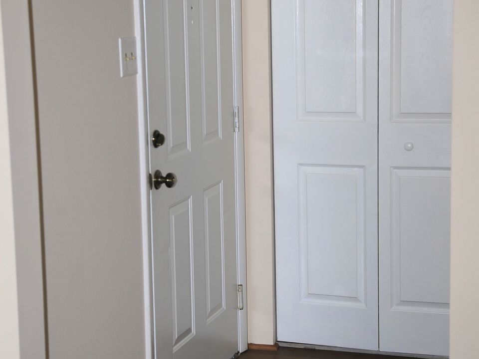 Condo entrance Closet and hall